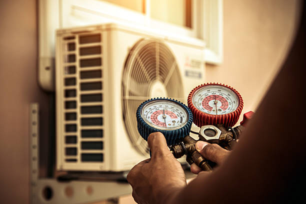 Professional Air Conditioning Service technician working in Sidney, MT